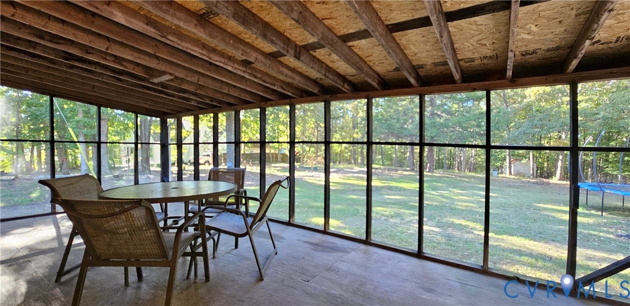 24110 Genito Road, Amelia, VA 23002 Enclosed porch featuring exposed wood-beam ceiling, full-length window screens, and solid surface flooring