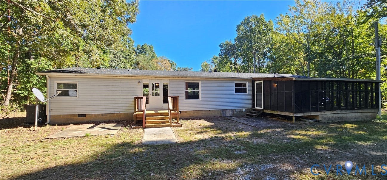 24110 Genito Road, Amelia, VA 23002 Light gray vinyl siding exterior featuring a screened-in porch, concrete patio, wood-framed stairs, and a multi-pane glass entry door