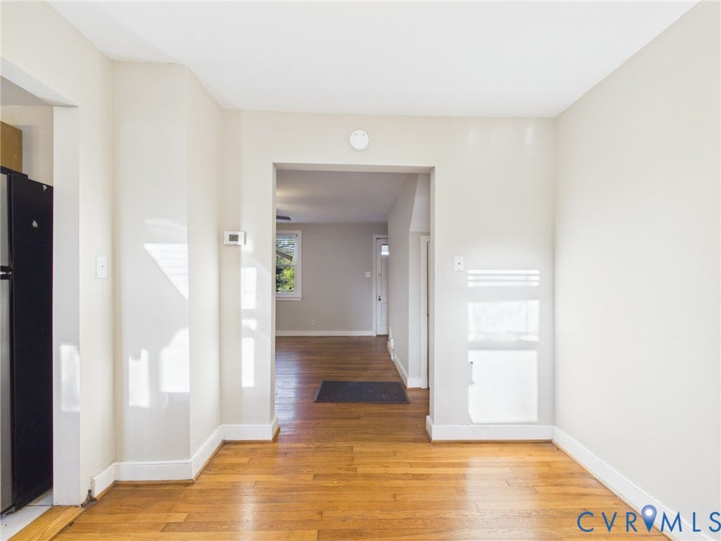 6902 Three Chopt Road, Richmond, VA 23226 Neutral-toned interior featuring wood-finish flooring and a rectangular entryway