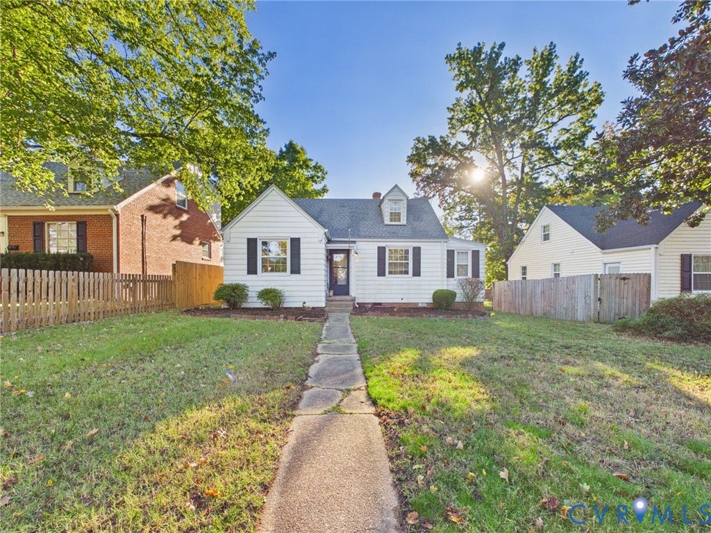 6902 Three Chopt Road, Richmond, VA 23226 Cape Cod style exterior featuring white horizontal siding, a central dormer window, black shutter accents, and a stone walkway