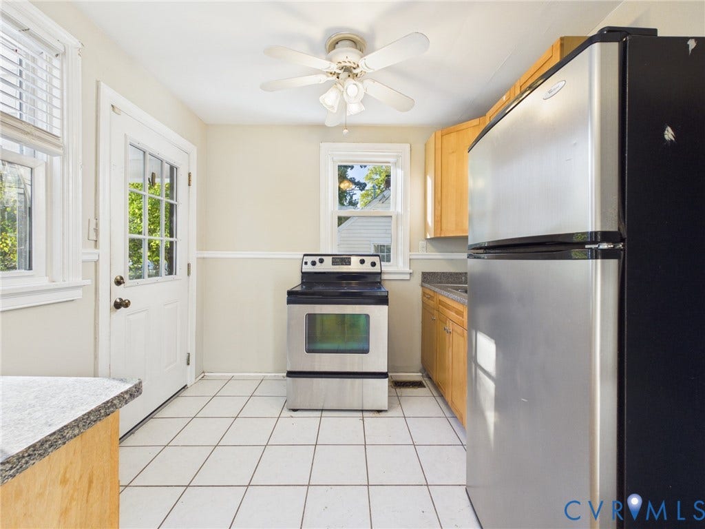 6902 Three Chopt Road, Richmond, VA 23226 Kitchen featuring wood cabinetry, stainless steel appliances, white ceramic tile flooring, and a ceiling-mounted light fixture with integrated fan