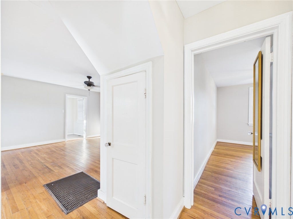 6902 Three Chopt Road, Richmond, VA 23226 Interior featuring neutral-toned walls, wood-finish flooring, solid-core doors with traditional hardware, and a ceiling-mounted fan