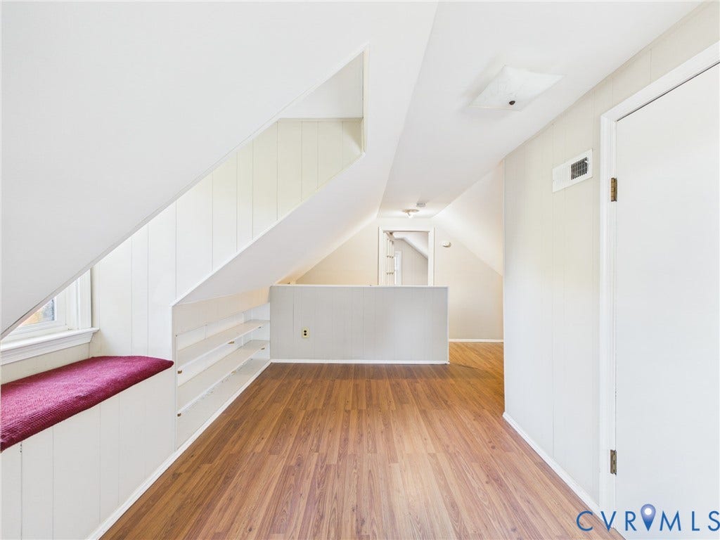 6902 Three Chopt Road, Richmond, VA 23226 Sloped ceilings with wood-finish flooring, built-in shelving, and a window bench