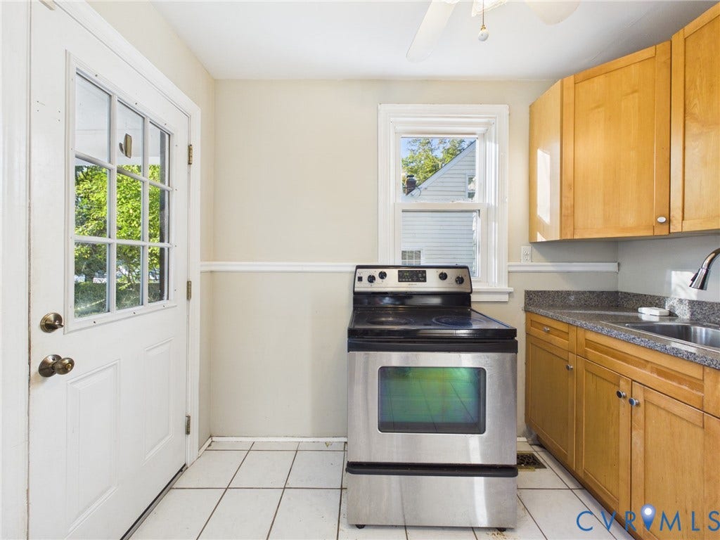 6902 Three Chopt Road, Richmond, VA 23226 Kitchen featuring light wood cabinetry, stone-finish countertops, a stainless steel range, ceramic tile flooring, and a glass-paneled exterior door