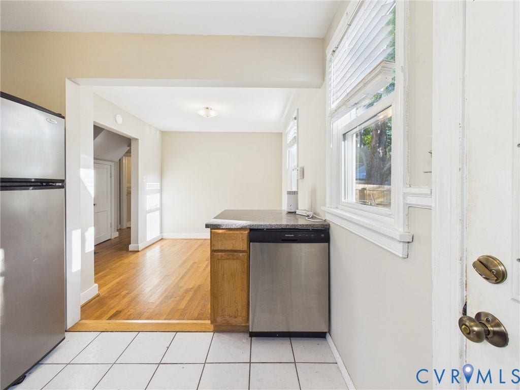 6902 Three Chopt Road, Richmond, VA 23226 Kitchen featuring wood-finish flooring, white tiled flooring, stainless steel dishwasher, stainless steel refrigerator, and stone-surface countertop