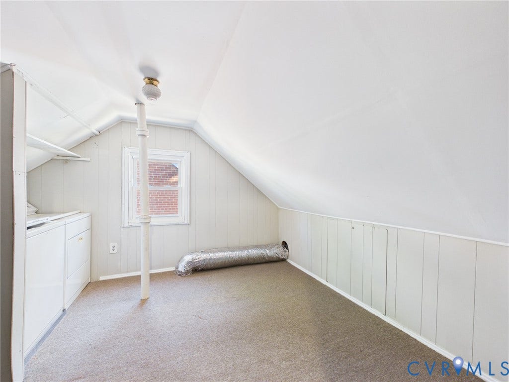 6902 Three Chopt Road, Richmond, VA 23226 Attic space featuring vaulted ceilings, paneled walls, carpeting, a single-hung window, and a vertical support column