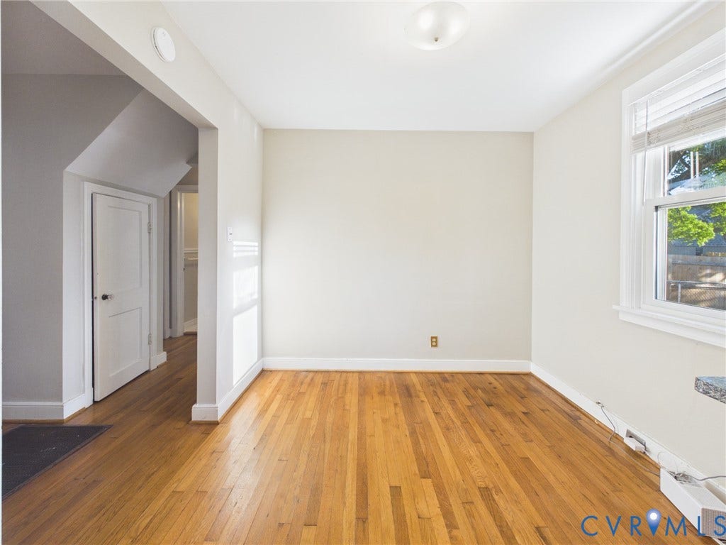6902 Three Chopt Road, Richmond, VA 23226 Interior space featuring wood-finish flooring, a double-hung window, and a multi-panel interior door