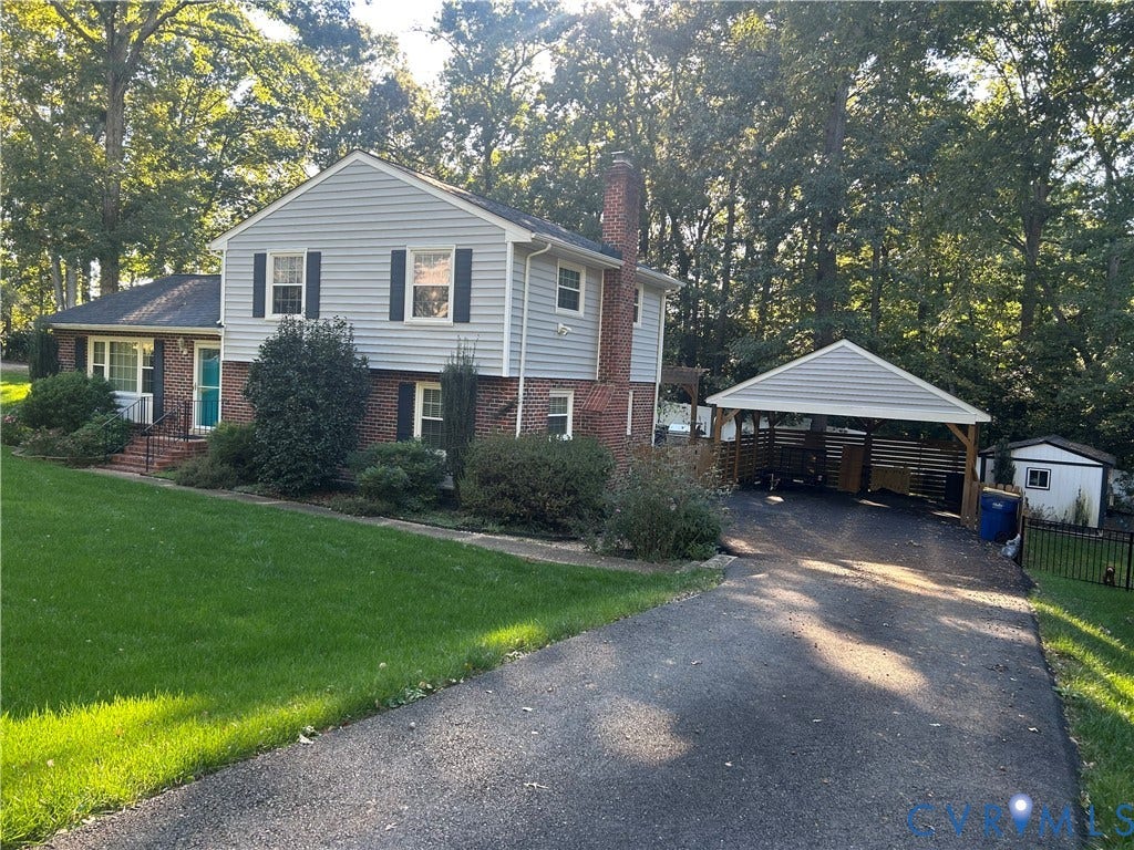 1120 Black Heath Road, Robious/Huguenot, Midlothian, VA 23113 Split-level exterior featuring brick and siding facade, chimney, attached carport, and paved driveway