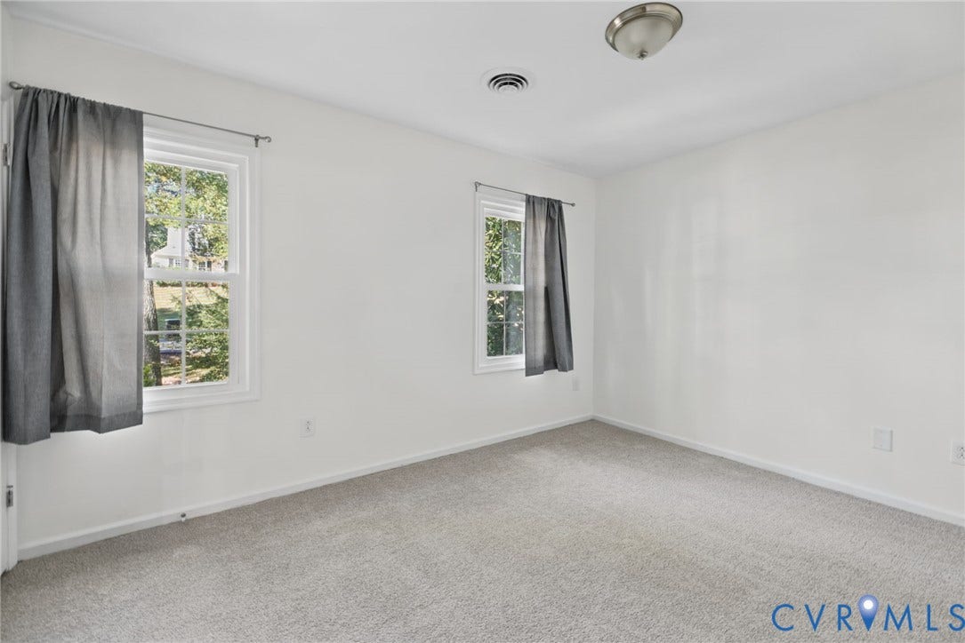 509 Overcliff Court, Walton Park, Midlothian, VA 23114 Neutral-toned wall-to-wall carpeting, dual double-hung windows, and a flush-mount ceiling fixture