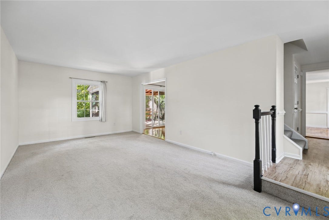 509 Overcliff Court, Walton Park, Midlothian, VA 23114 Neutral-toned wall finish, wall-to-wall carpeting, wood-finish flooring at the entryway, and a black-and-white metal balustrade featuring decorative posts