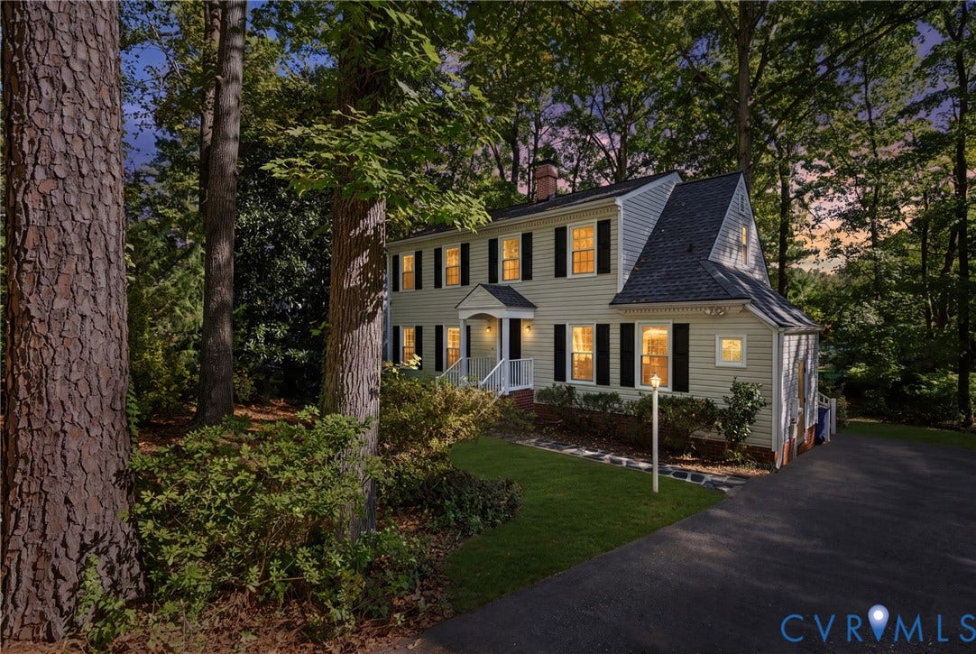 509 Overcliff Court, Walton Park, Midlothian, VA 23114 Two-story residence featuring light-colored horizontal siding, black shutters, an asphalt shingle roof, a covered front entryway, and a paved driveway
