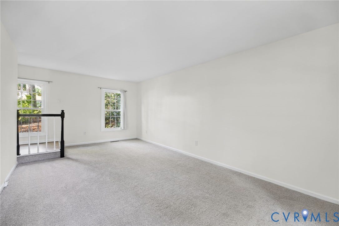 509 Overcliff Court, Walton Park, Midlothian, VA 23114 Neutral-toned wall paint, plush carpeting, multi-pane windows, and a staircase featuring a dark-finish wooden handrail with white balusters