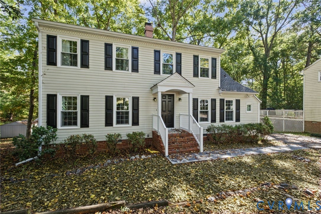 509 Overcliff Court, Walton Park, Midlothian, VA 23114 Two-story exterior featuring light-toned horizontal siding, dark window shutters, a brick-front entrance staircase, a covered entryway, and stone-paved walkway