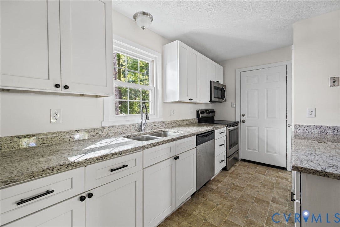 509 Overcliff Court, Walton Park, Midlothian, VA 23114 Kitchen featuring white shaker-style cabinetry, stone-finish countertops, stainless steel appliances, a double-basin undermount sink with a gooseneck faucet, and tiled flooring