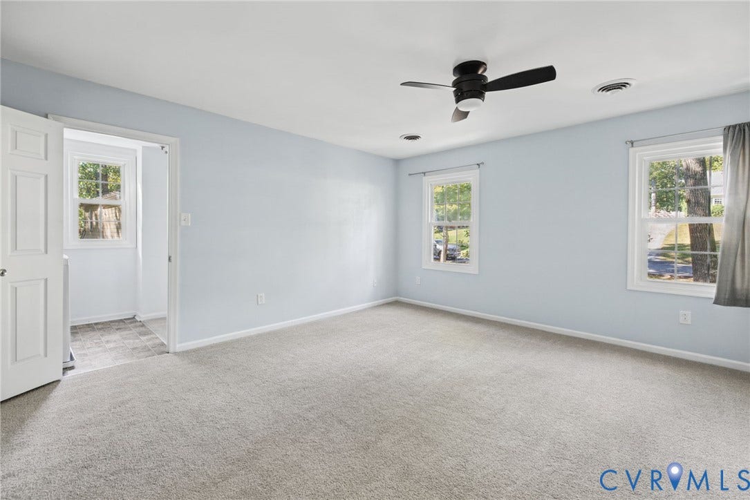 509 Overcliff Court, Walton Park, Midlothian, VA 23114 Neutral-toned carpeting, multi-pane windows, and a ceiling-mounted fan with integrated lighting