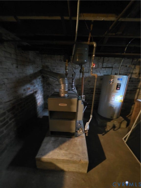 4114 Crestwood Road, Established, Richmond, VA 23227 Mechanical area featuring a furnace, water heater, metal ducting, and exposed brick masonry
