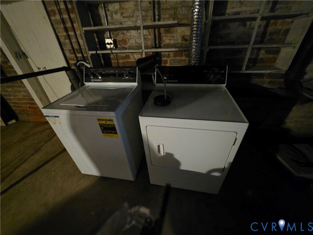 4114 Crestwood Road, Established, Richmond, VA 23227 Dedicated laundry area featuring exposed brick masonry walls and built-in industrial-style shelving