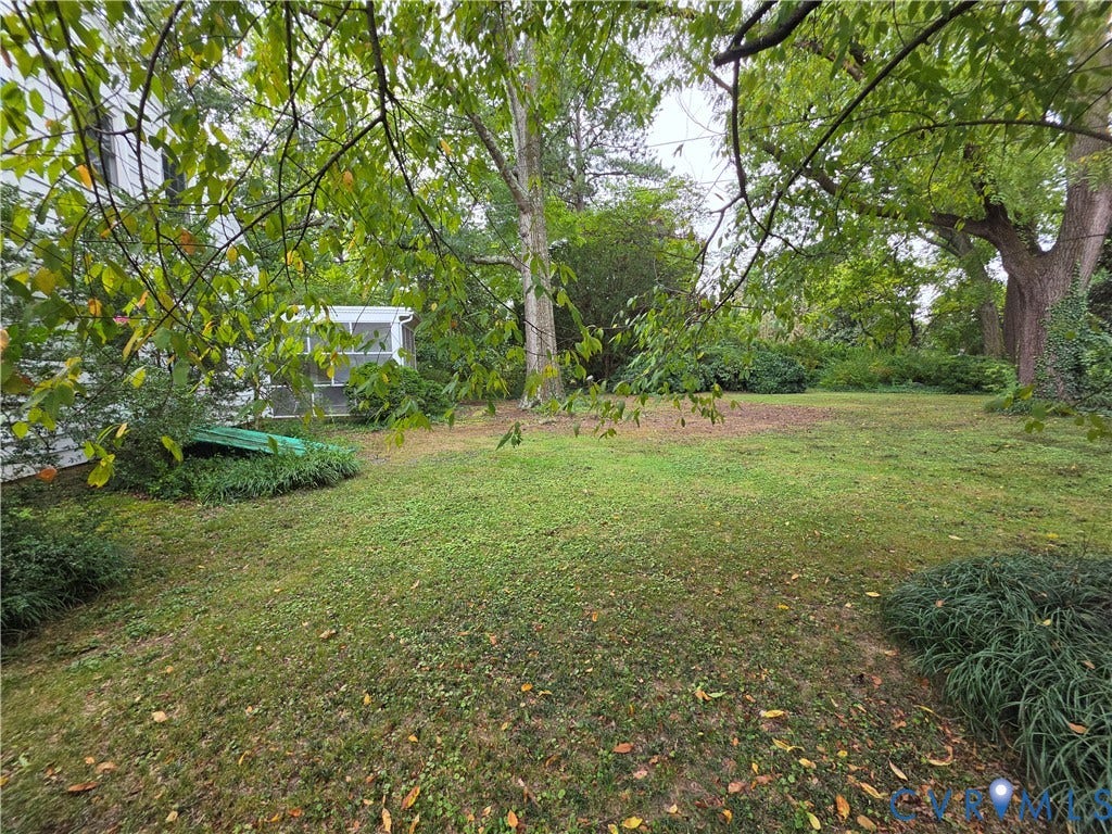 4114 Crestwood Road, Established, Richmond, VA 23227 Expansive backyard featuring mature trees, established landscaping, and a detached screened structure