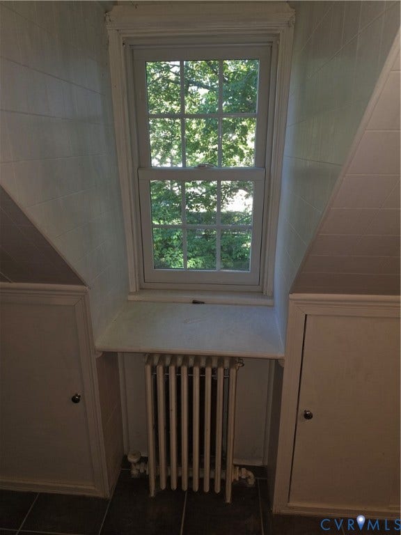 4114 Crestwood Road, Established, Richmond, VA 23227 Multi-pane sash window with a deep sill, flanked by built-in cabinetry featuring recessed-panel doors and finished with a metallic radiator