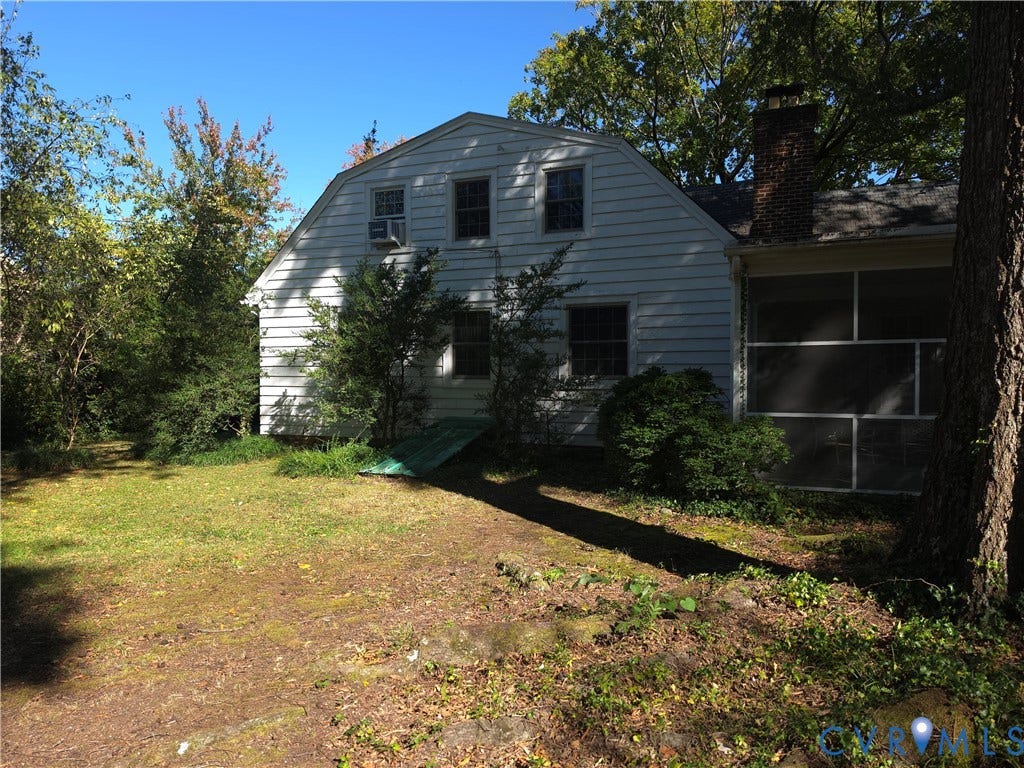 4114 Crestwood Road, Established, Richmond, VA 23227 Dutch colonial exterior featuring white horizontal siding, a brick chimney, and an enclosed porch
