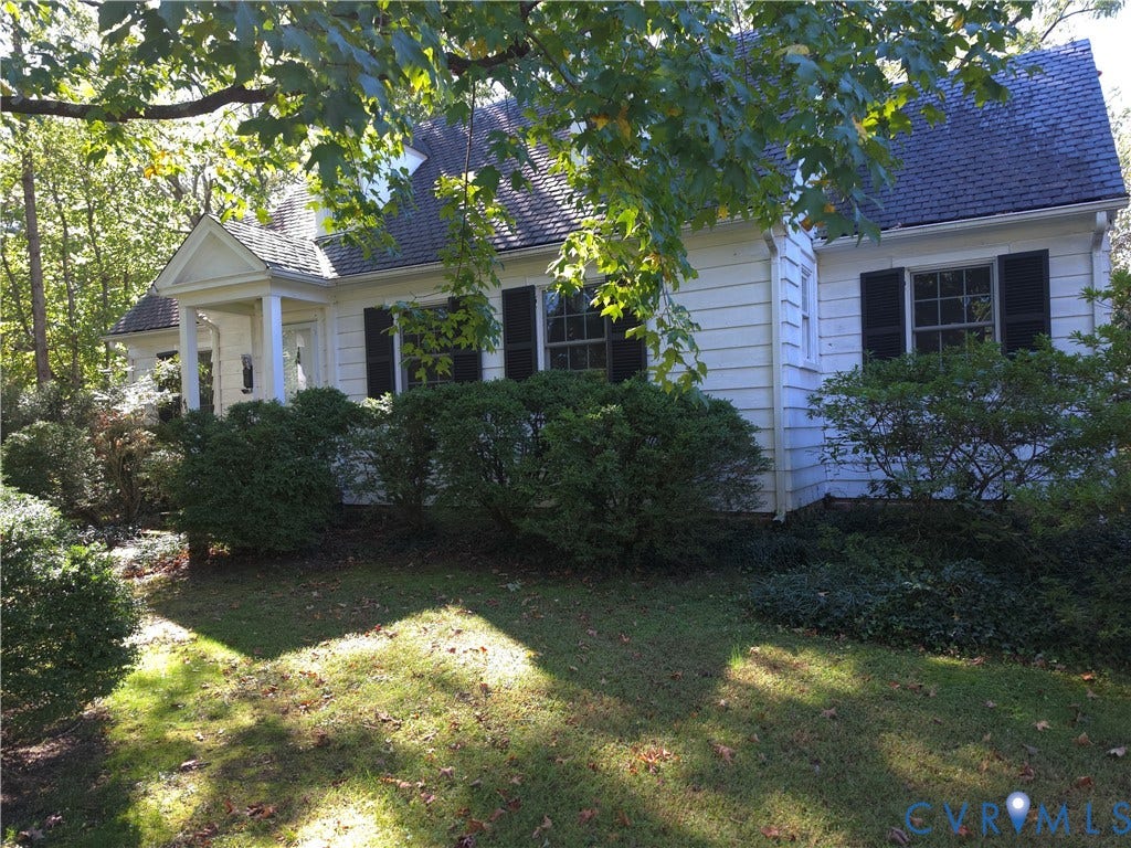 4114 Crestwood Road, Established, Richmond, VA 23227 Traditional exterior featuring white horizontal siding, dark decorative shutters, a covered front entryway, and a gable roof