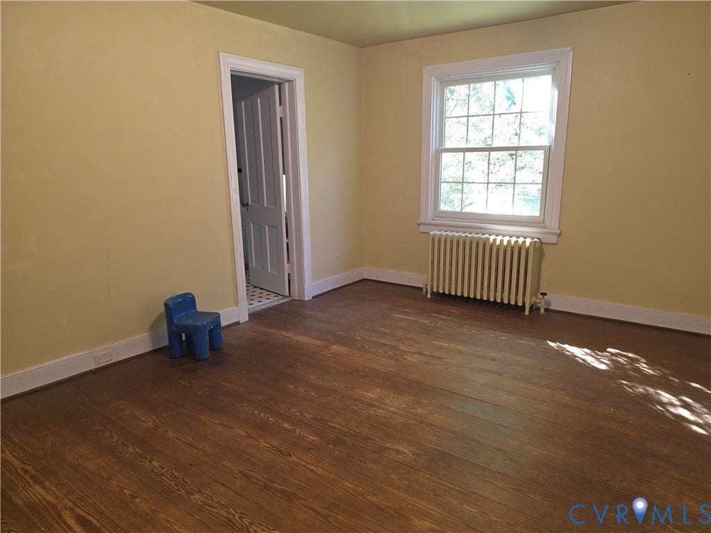 4114 Crestwood Road, Established, Richmond, VA 23227 Hardwood flooring, multi-pane window with traditional casing, and cast-iron radiator