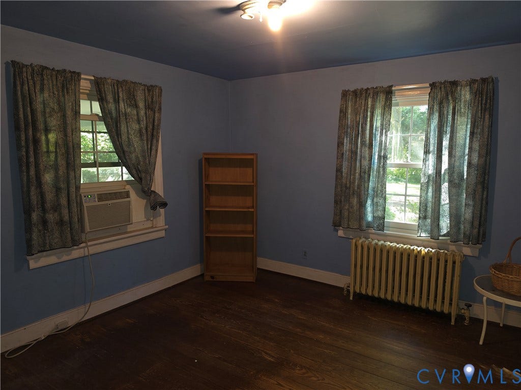 4114 Crestwood Road, Established, Richmond, VA 23227 Room featuring wood-finish flooring, two multi-pane windows, and a metal radiator