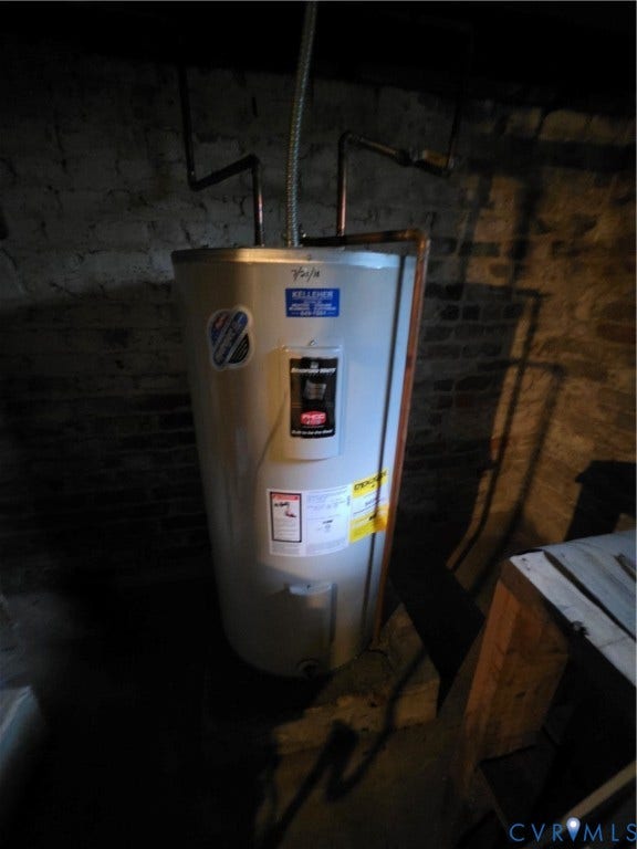 4114 Crestwood Road, Established, Richmond, VA 23227 Electric water heater unit featuring copper plumbing lines and exposed masonry wall finish
