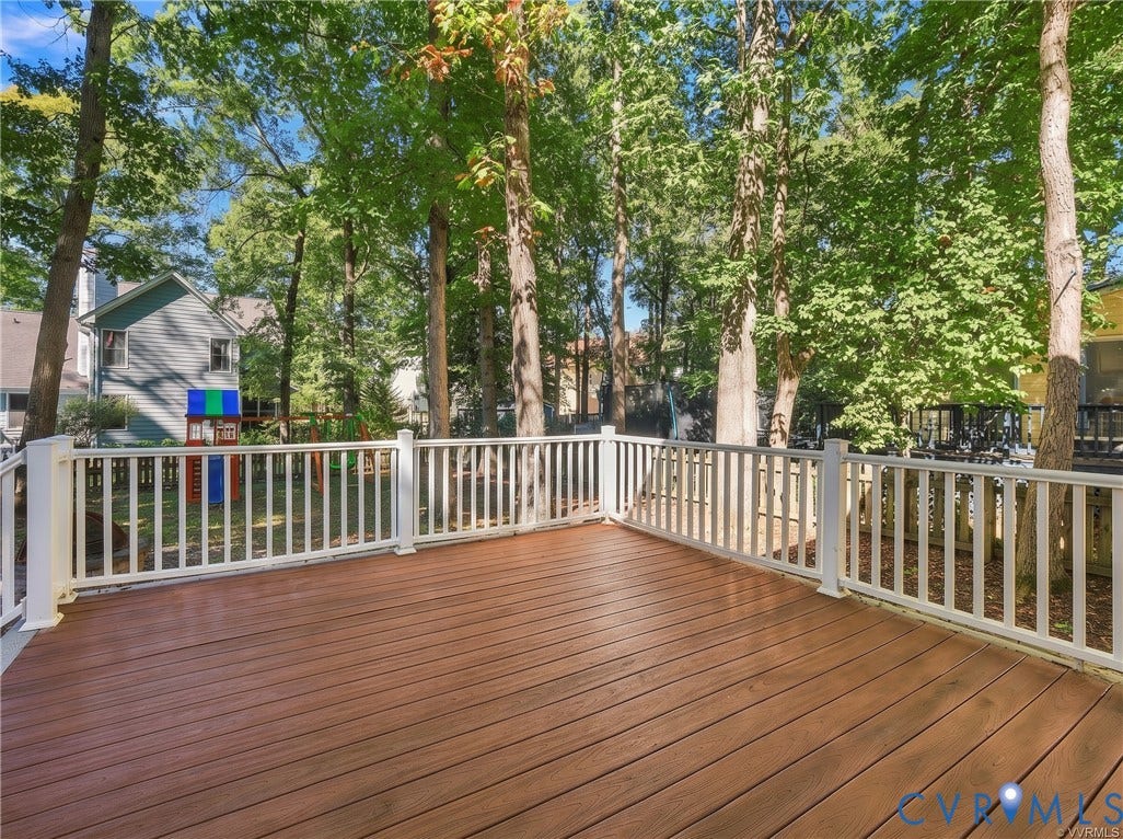 4712 Cedar Forest Road, Glen Allen, VA 23060 Enjoy peaceful views of the wooded backyard from the spacious deck, perfect for outdoor gatherings or quiet evenings at home.