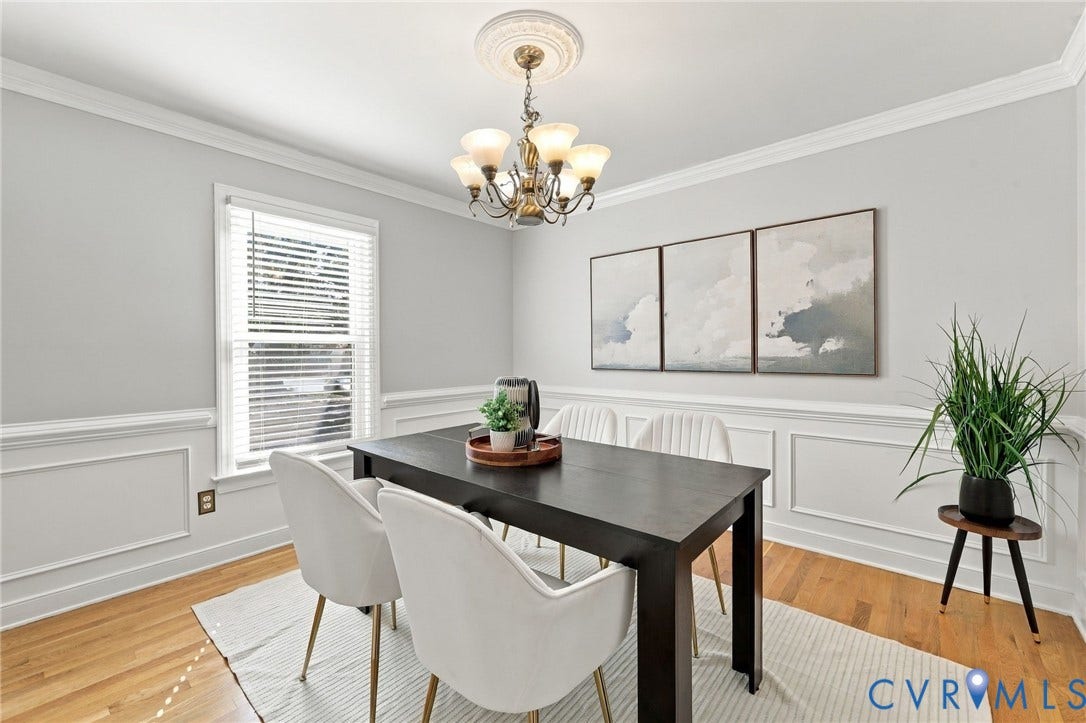 4712 Cedar Forest Road, Glen Allen, VA 23060 Bright dining room featuring timeless architectural details, hardwood floors, and a large window.