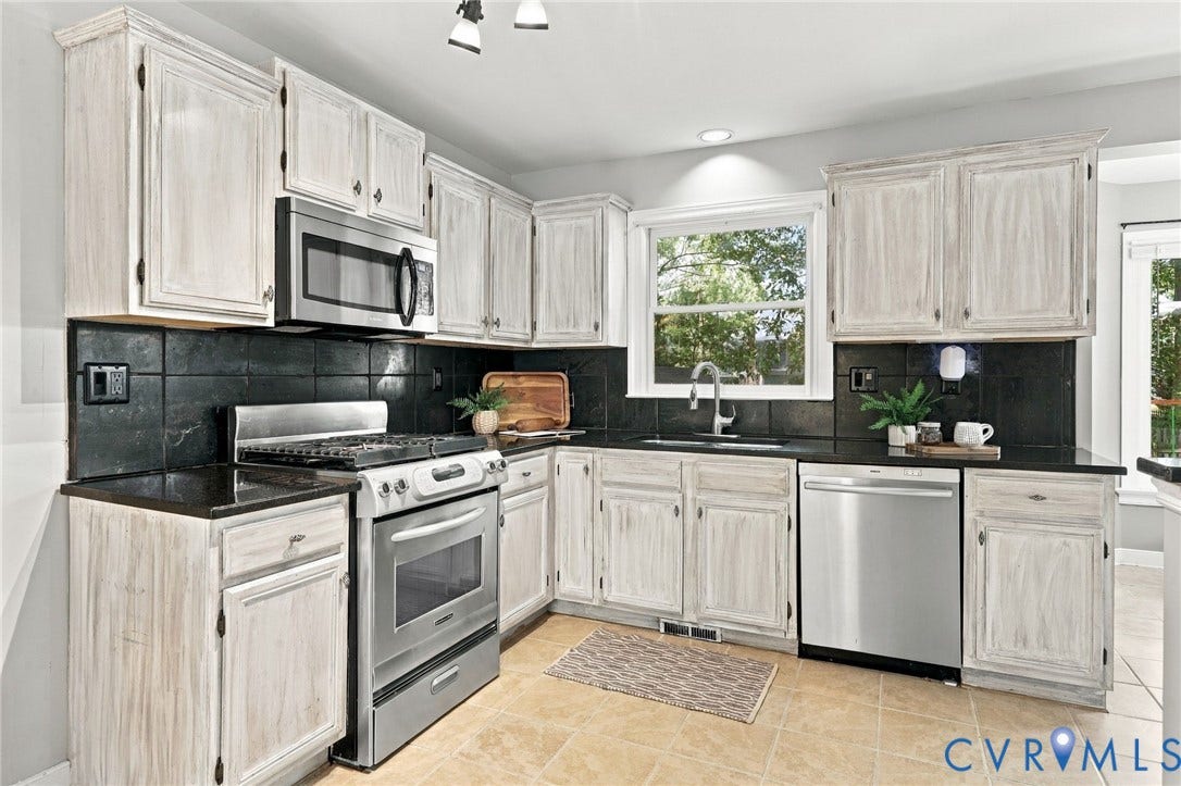 4712 Cedar Forest Road, Glen Allen, VA 23060 Kitchen with stainless steel range and built-in microwave, tile flooring, and ample cabinetry for storage.