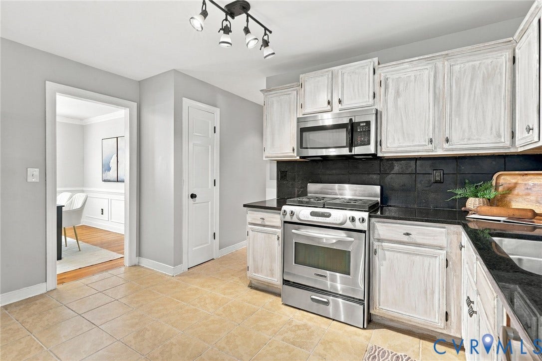 4712 Cedar Forest Road, Glen Allen, VA 23060 Door next to dining room is the pantry, then down the hallway leads to a half bath and door leading to garage.