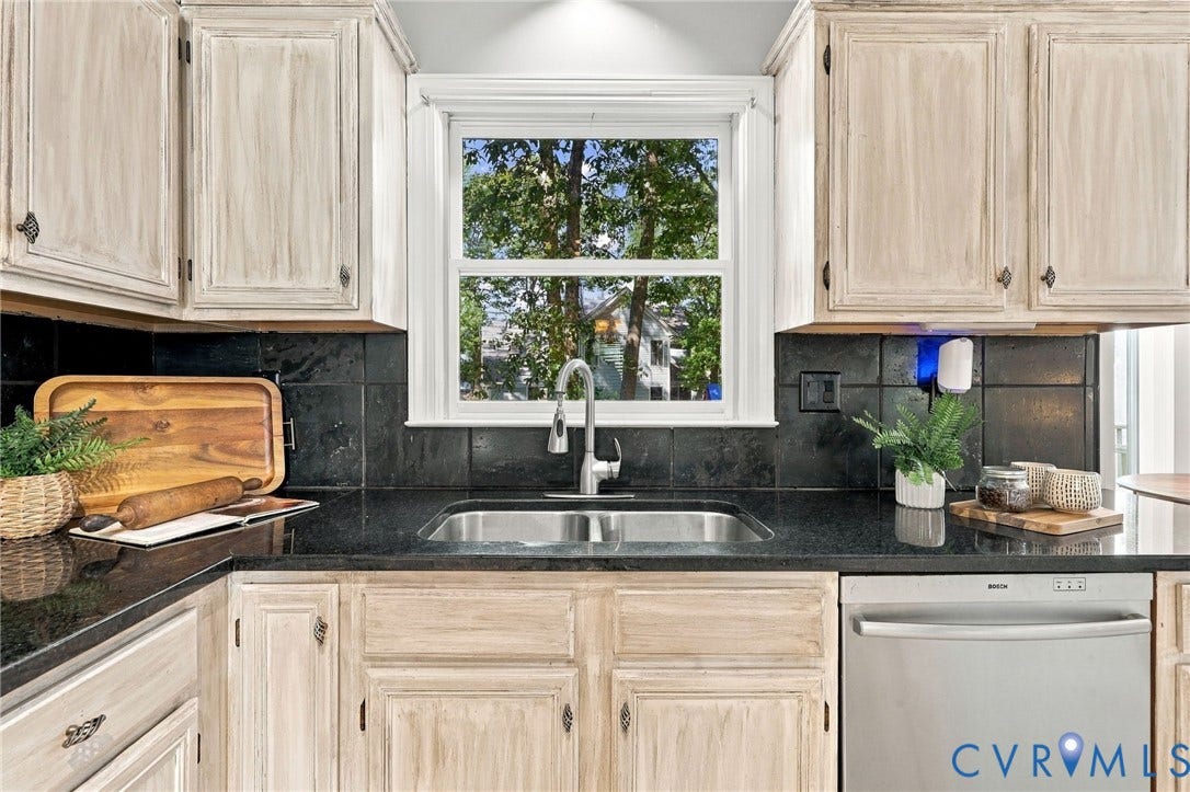 4712 Cedar Forest Road, Glen Allen, VA 23060 Kitchen featuring granite countertops, tile backsplash and a window overlooking the backyard.