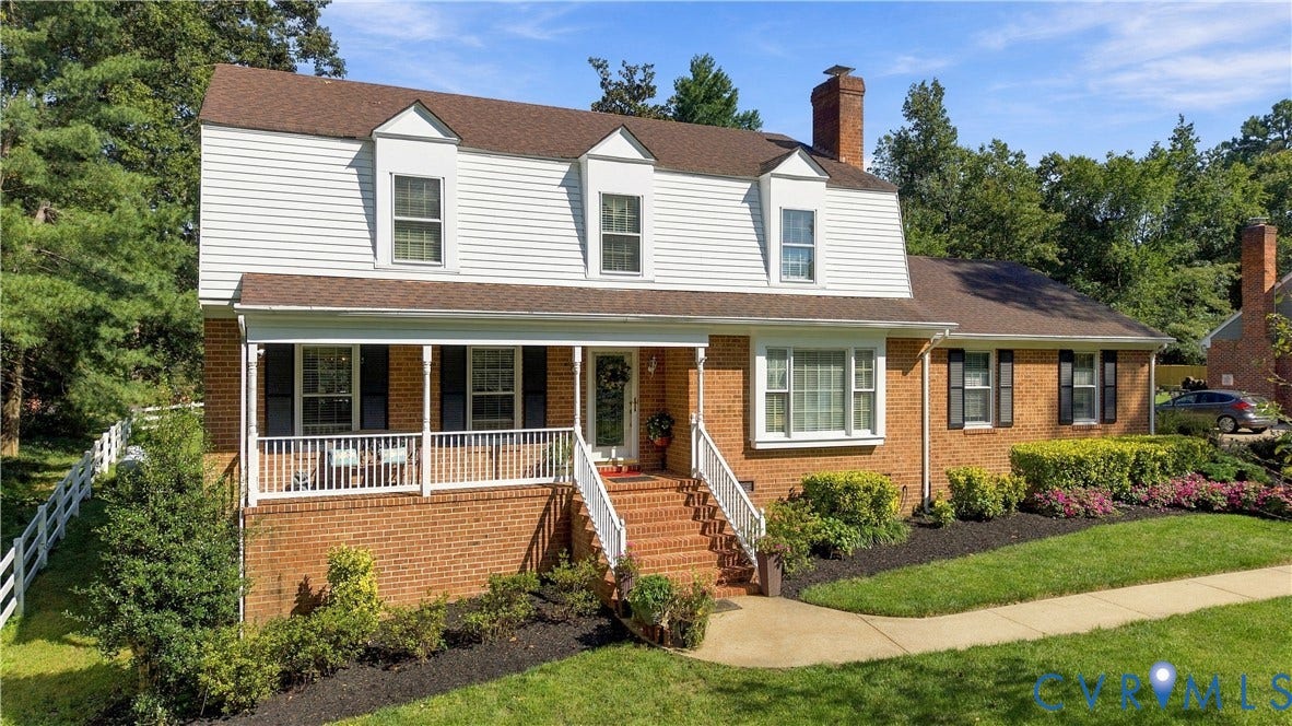 8307 Wallingford Lane, Chickahominy Bluffs, Henrico, VA 23227 Dutch Colonial exterior featuring brick and siding facade, covered front porch with white railing, brick staircase, and multi-pane windows with shutters