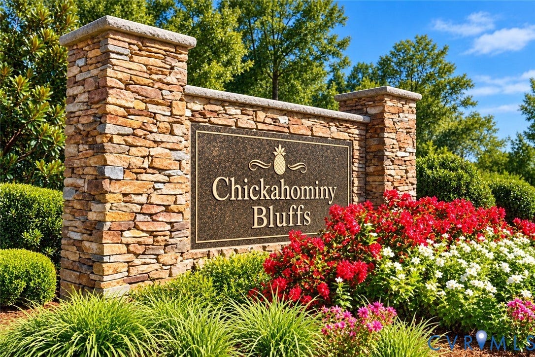 8307 Wallingford Lane, Chickahominy Bluffs, Henrico, VA 23227 Community monument sign featuring stacked stone pillars, decorative metal signage, and integrated landscaping with manicured shrubs and flowering perennials
