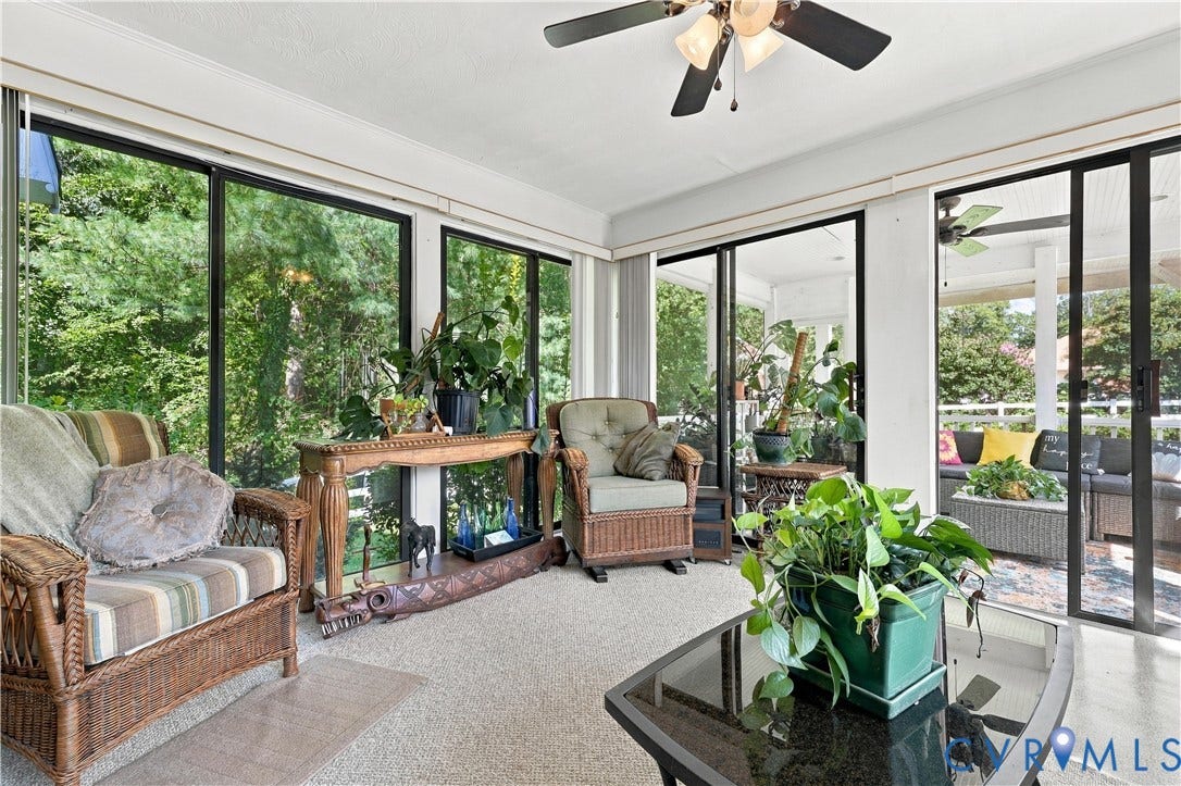 8307 Wallingford Lane, Chickahominy Bluffs, Henrico, VA 23227 Enclosed sunroom featuring floor-to-ceiling glass sliding doors, neutral carpeting, and a ceiling fan with integrated lighting