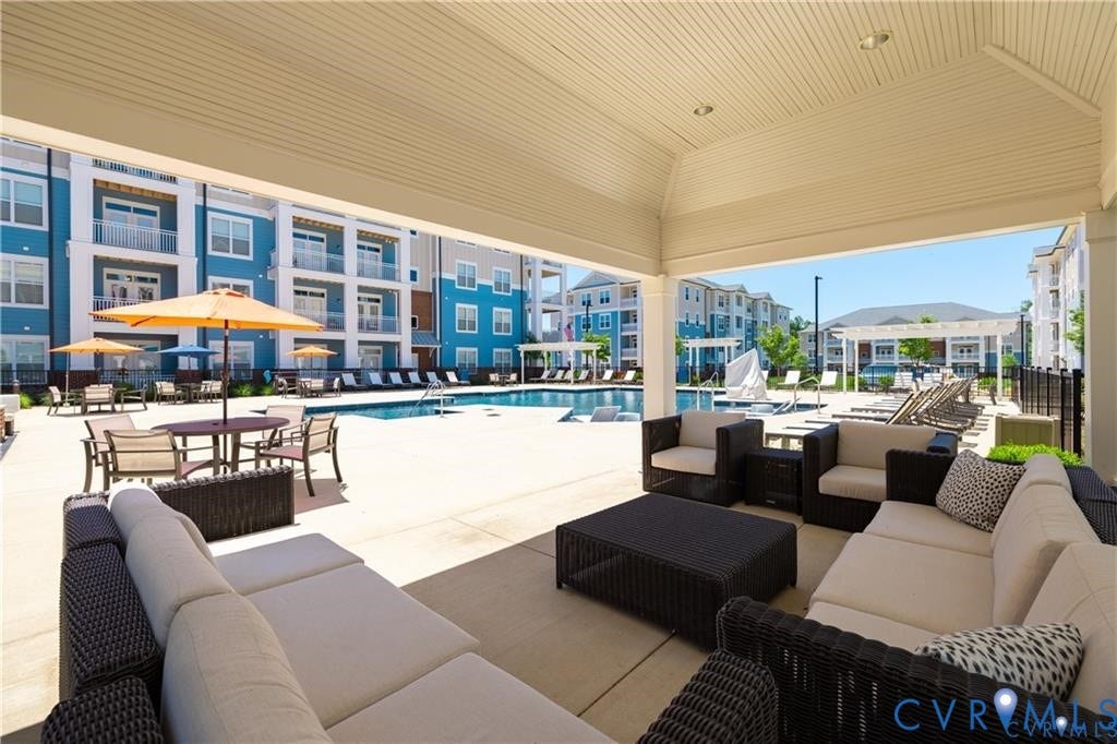 10525 Stony Bluff Drive, #107, Stony Run Condos, Ashland, VA 23005 Covered outdoor lounge area with recessed lighting, concrete patio, and swimming pool