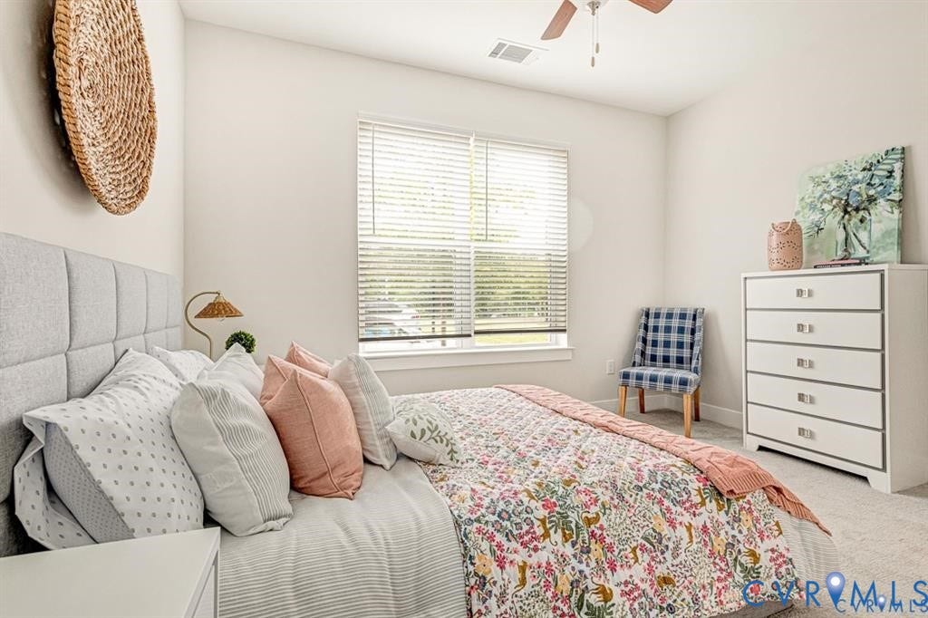 10525 Stony Bluff Drive, #107, Stony Run Condos, Ashland, VA 23005 Neutral interior space featuring high-pile carpeting, neutral wall color, large window with horizontal blinds, and a ceiling-mounted fan