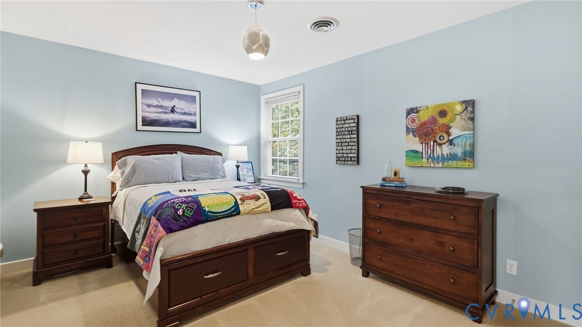 2040 Normandstone Drive, Roxshire, Midlothian, VA 23113 Bedroom featuring light blue wall paint, neutral carpeting, multi-pane window, and modern pendant lighting