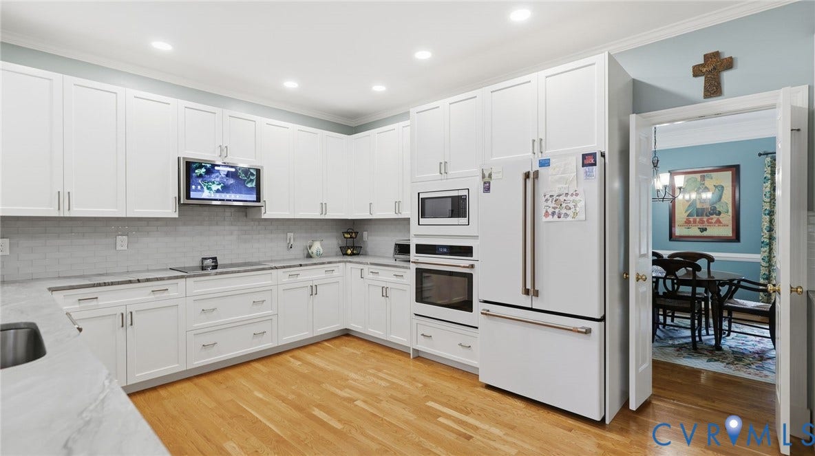 2040 Normandstone Drive, Roxshire, Midlothian, VA 23113 Kitchen featuring white shaker-style cabinetry, light stone-finish countertops, subway tile backsplash, recessed lighting, and built-in stainless steel double wall ovens