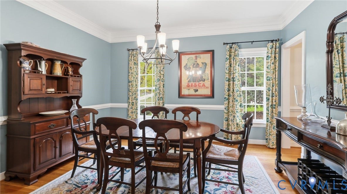 2040 Normandstone Drive, Roxshire, Midlothian, VA 23113 Dining room featuring crown molding, chair rail trim, wood-finish flooring, and a multi-light chandelier