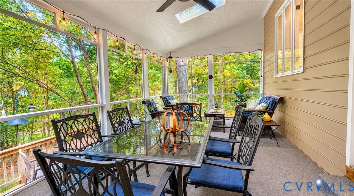 2040 Normandstone Drive, Roxshire, Midlothian, VA 23113 Screened porch featuring a vaulted beadboard ceiling, integrated skylight, ceiling fan, and horizontal siding