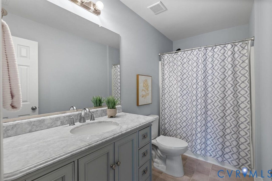 4011 Echo Ridge Place, Midlothian, VA 23112 Hall bath featuring large vanity with stone countertop, and tub/shower enclosure