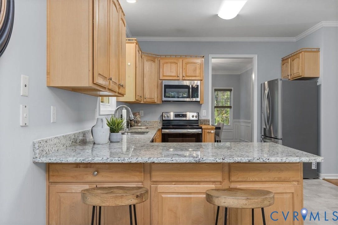 4011 Echo Ridge Place, Midlothian, VA 23112 Kitchen featuring natural wood cabinetry, Granite countertops, stainless steel appliances, and vinyl flooring