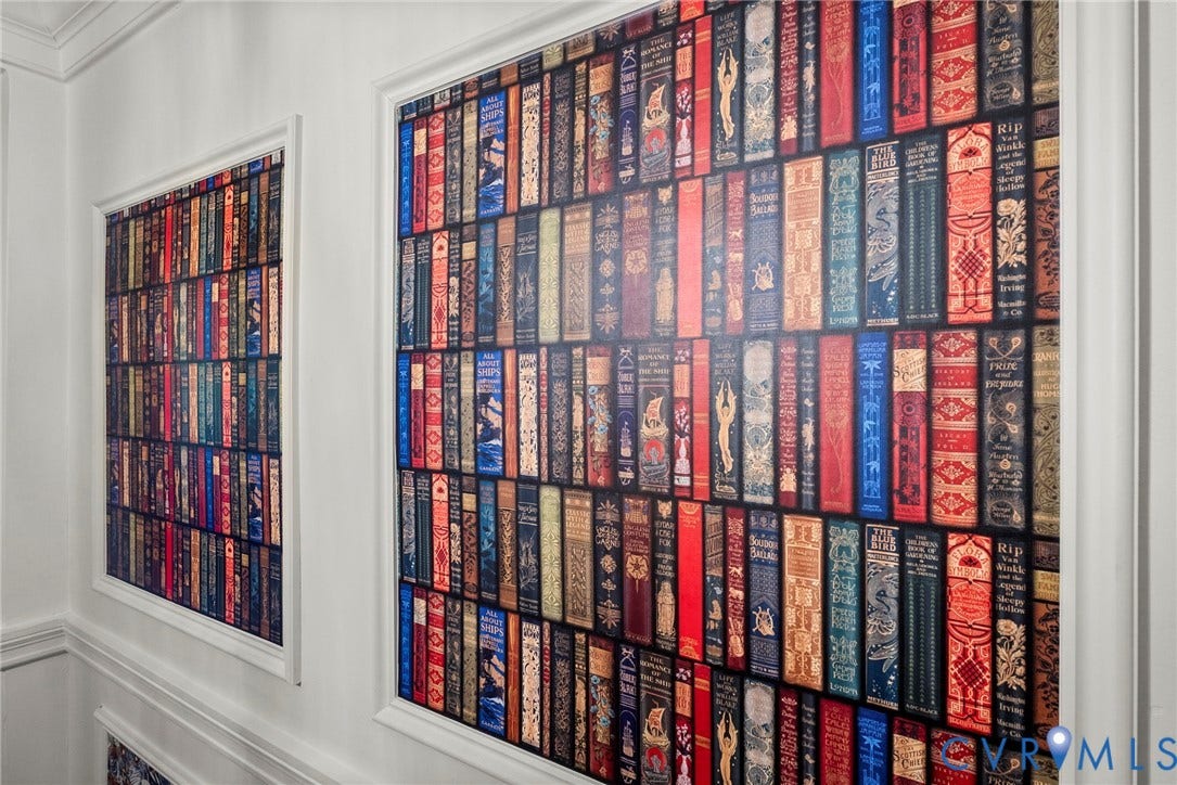 2416 Park Avenue, #U4, The Fan District, Richmond, VA 23220 Wall panels featuring vibrant, book-spine patterned wallpaper enclosed by decorative white molding