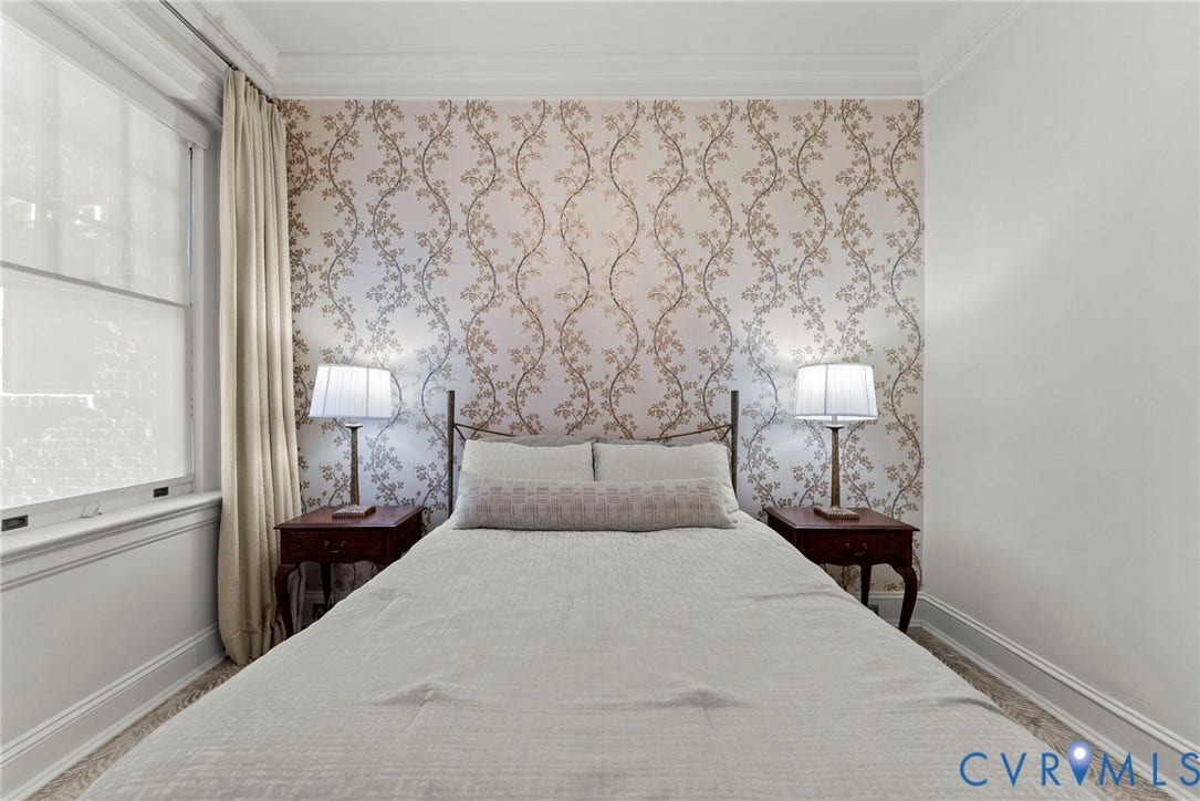 2416 Park Avenue, #U4, The Fan District, Richmond, VA 23220 Bedroom featuring patterned wallpaper, crown molding, and sash windows