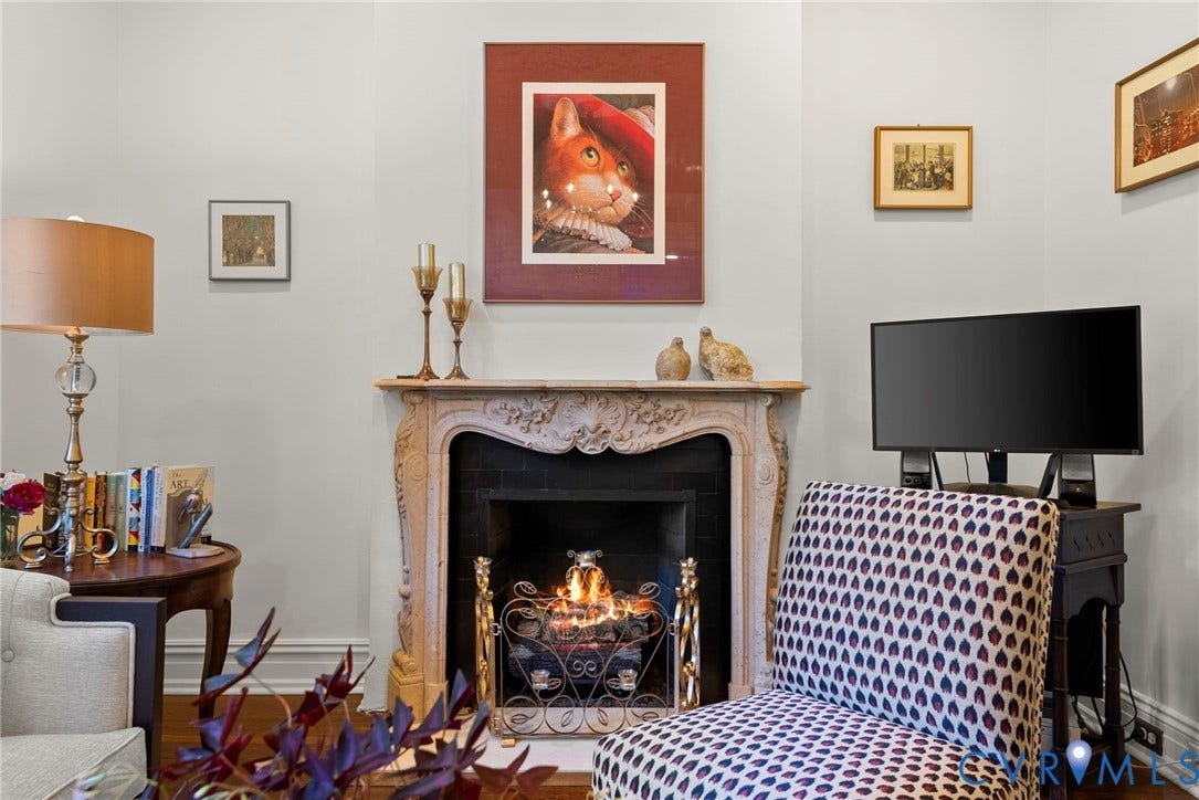 2416 Park Avenue, #U4, The Fan District, Richmond, VA 23220 Ornate stone-carved fireplace mantel with a dark tile surround