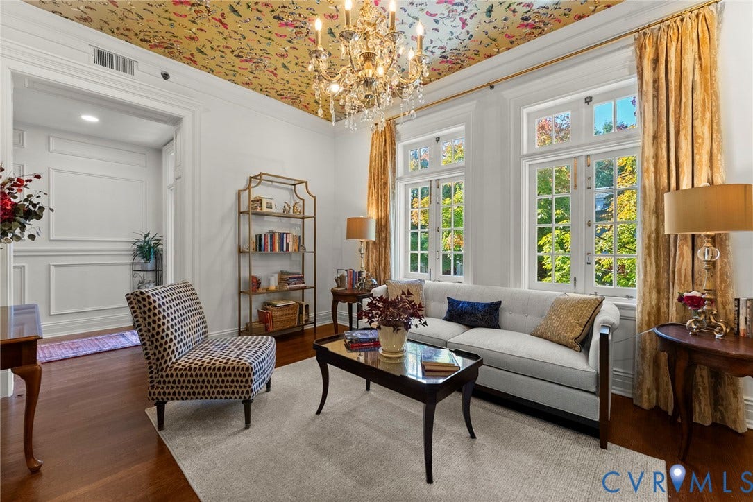 2416 Park Avenue, #U4, The Fan District, Richmond, VA 23220 Living area featuring wood-finish flooring, decorative ceiling paper, multi-pane windows, and an ornate crystal chandelier