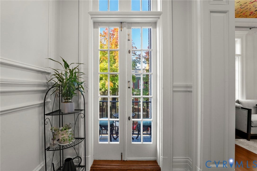 2416 Park Avenue, #U4, The Fan District, Richmond, VA 23220 French doors featuring divided-lite glass panes, transom window, detailed wall wainscoting, and wood flooring