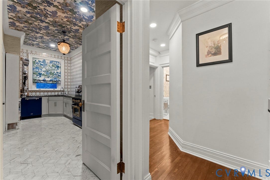 2416 Park Avenue, #U4, The Fan District, Richmond, VA 23220 Kitchen featuring patterned ceiling wallpaper, geometric floor tile, built-in cabinetry, and recessed lighting, with hardwood flooring in the foyer